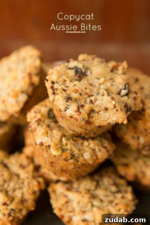 Have you ever had those Aussie Bites from Costco? They are such a great healthy snack on the go and now you can try our Aussie Bites Copycat Recipe! a photo of a pile of baked golden brown aussie bites
