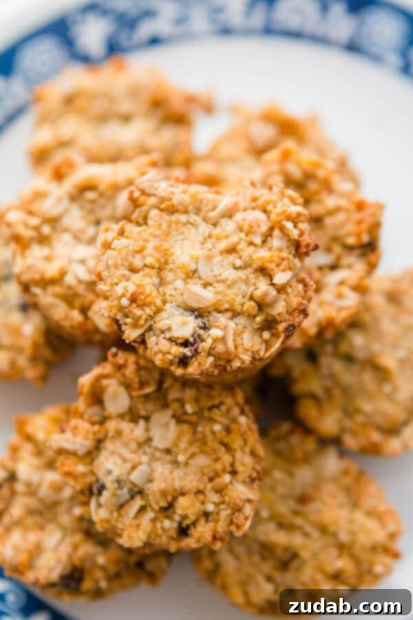 Have you ever had those Aussie Bites from Costco? They are such a great healthy snack on the go and now you can try our Aussie Bites Copycat Recipe! a photo taken over the top of a pile of golden baked Aussie bites