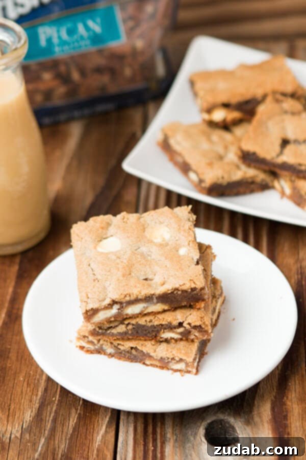 Maple Pecan Blondies, the ultimate brownie of the year, featuring a decadent White Chocolate Butter Sauce and rich pecan butter. ohsweetbasil.com