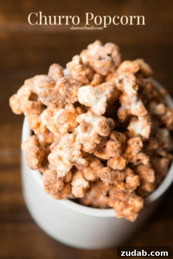 Delicious Churro Popcorn A large bowl of golden, sweet churro popcorn, freshly coated in cinnamon sugar and ready to be served.