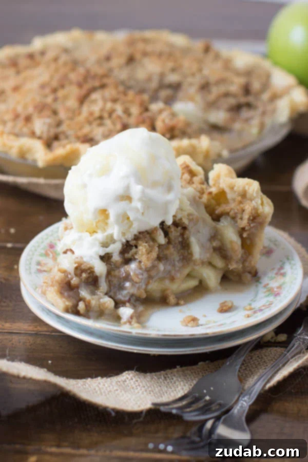 Heavenly No-Bake Banana Pudding Pie with Nilla Wafer Crust 12 A slice of the best Dutch apple pie ever, served on a white plate, symbolizing a perfect Thanksgiving dessert.