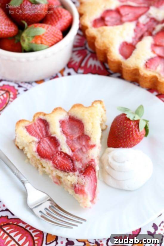Homemade Strawberry Cake with Coconut Whipped Cream Topping Close-up of Homemade Strawberry Cake with Coconut Whipped Cream