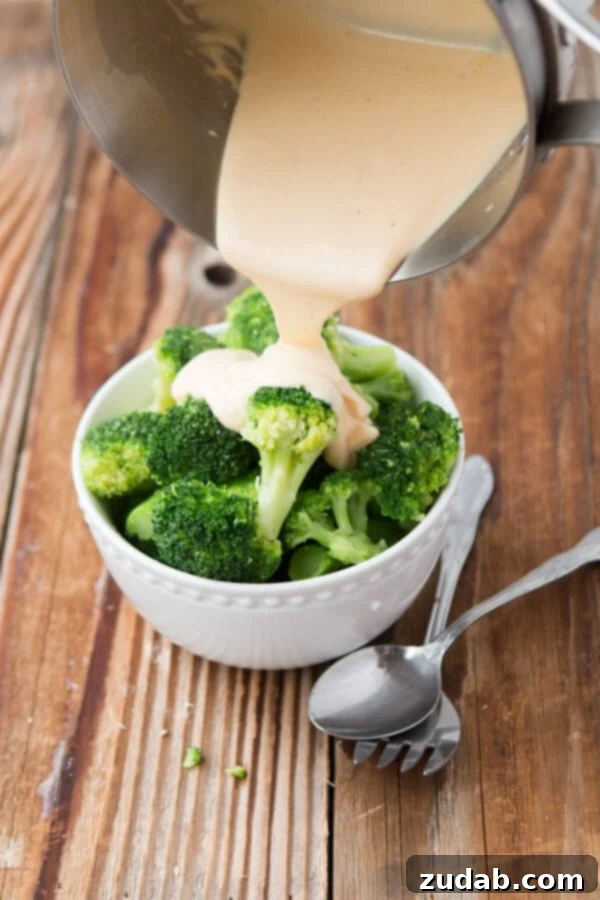 Broccoli with creamy, homemade real cheese sauce. A delicious side dish from ohsweetbasil.com