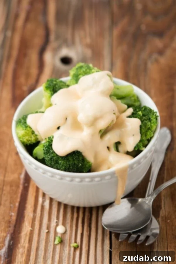 Freshly steamed broccoli coated in a rich, homemade real cheese sauce from ohsweetbasil.com