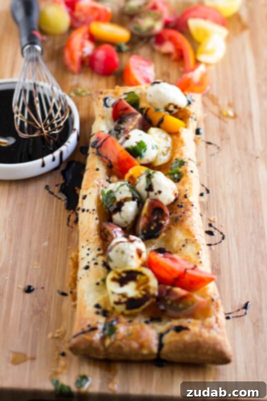 Heriloom tomatoes, puff pastry, marinated mozzarella and balsamic reduction and guess what, all of it is premade and you can whip it all together. ohsweetbasil.com_-3