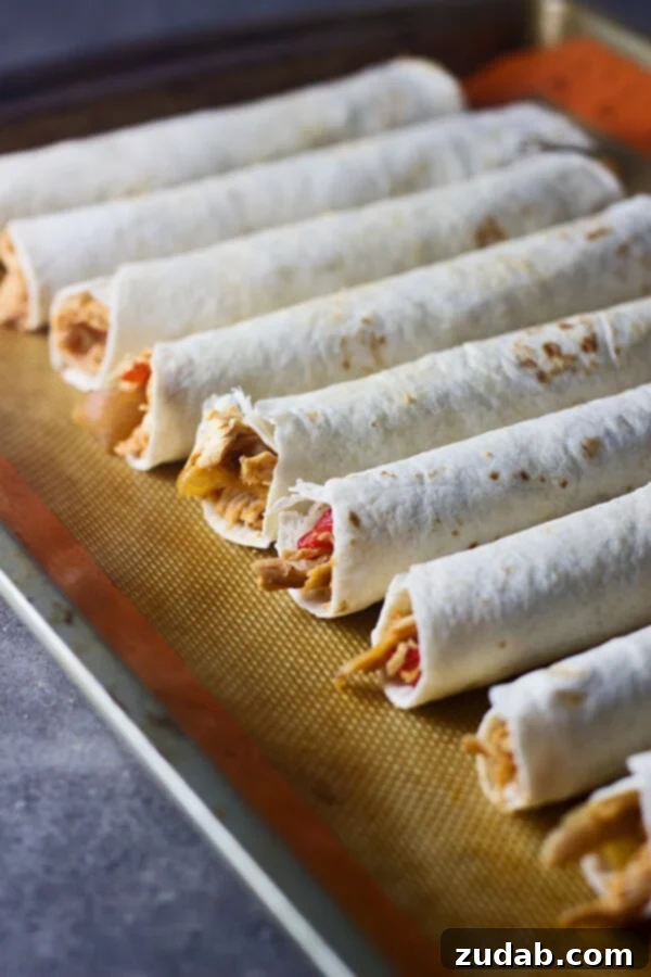 Cheesy Spicy Chicken Flautas Ingredients for Cheesy Spicy Chicken Flautas - sautéed vegetables and shredded chicken