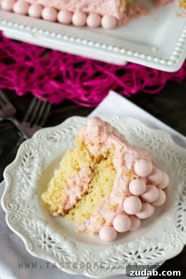 Easy Strawberry Whoppers Cake Decoration Strawberry Malted Milkshake Cake topped with Strawberry Whoppers candies, ready for a celebration.