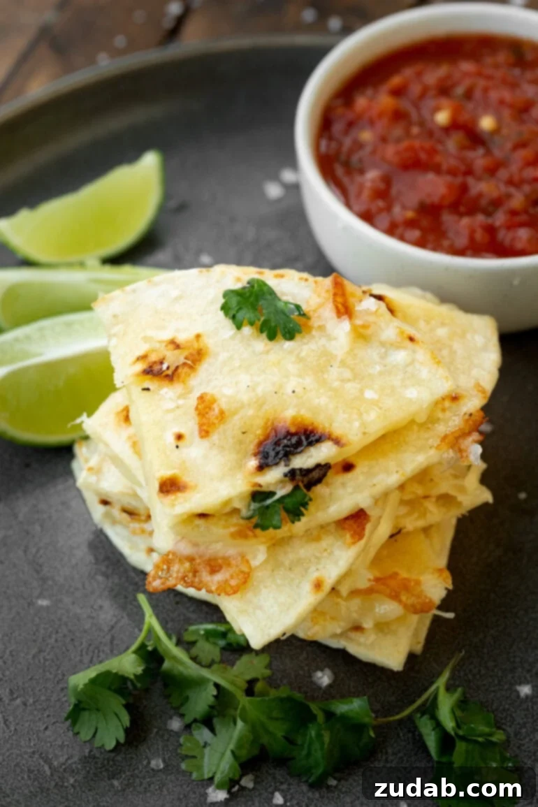 Unlocking Quesadilla Perfection 12 A stack of triangular pieces of cheese quesadillas made with corn tortillas, demonstrating a delicious and authentic variation.