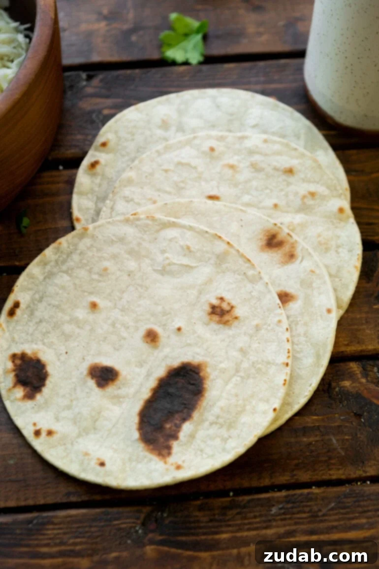 Unlocking Quesadilla Perfection 3 Several perfectly cooked, warm flour tortillas stacked and ready for assembly into delicious quesadillas, highlighting the importance of fresh tortillas in a great recipe.