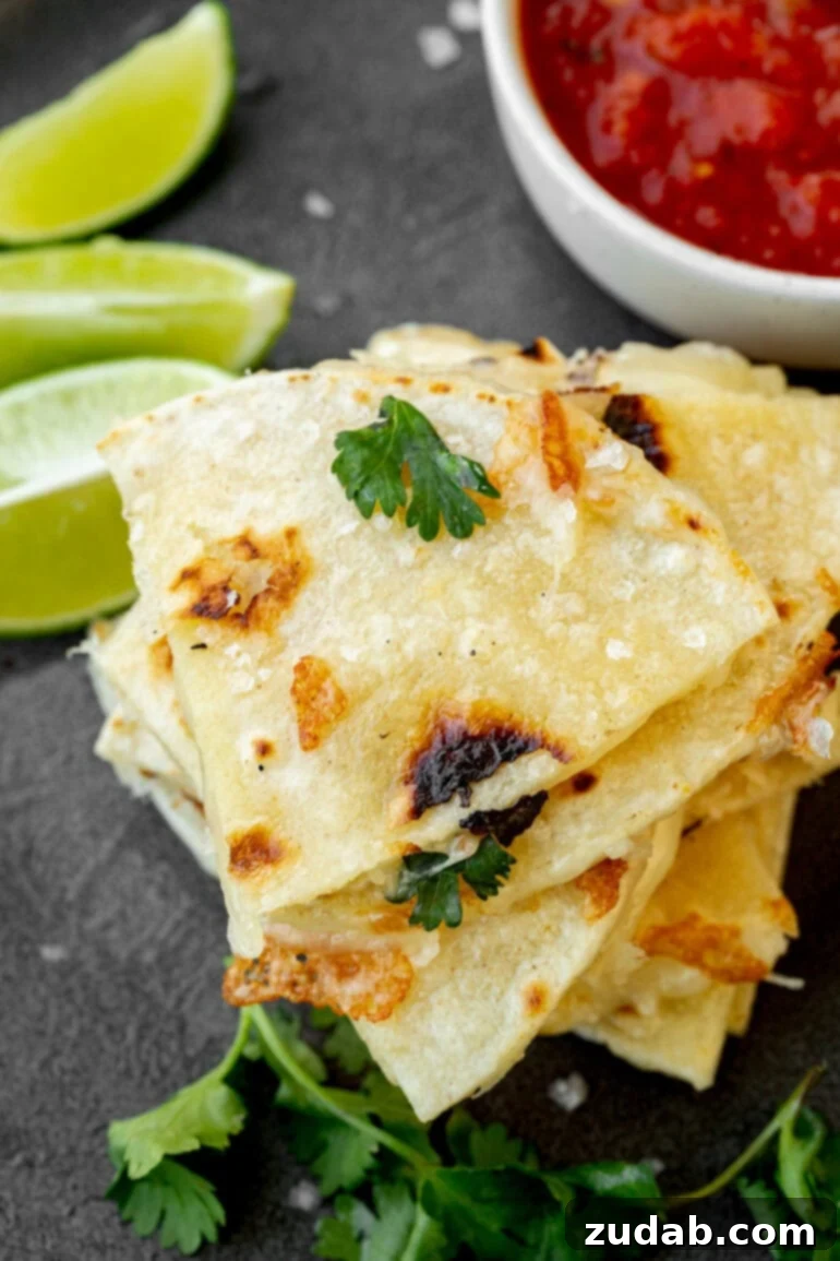 Unlocking Quesadilla Perfection 9 A stack of perfectly cooked, golden corn tortilla quesadilla pieces, showcasing their unique texture and inviting color.
