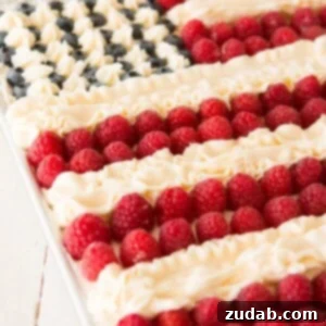 Show Your True Colors Cake 2 Patriotic Flag Cake: A fluffy white cake base, rich whipped cream frosting, and vibrant fresh berries arranged like a flag.