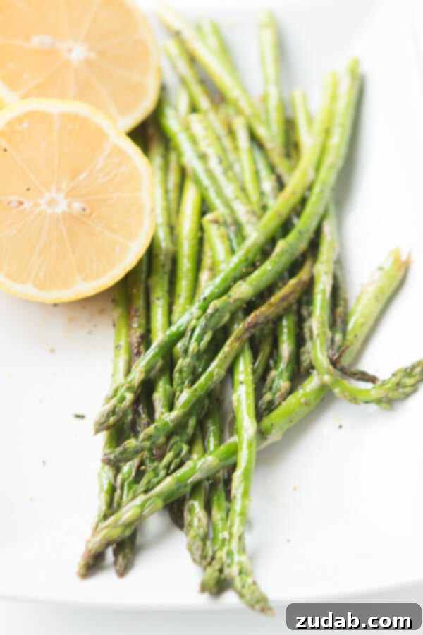 Grilled asparagus with lemon pepper seasoning, a perfect light side dish for chicken kabobs.