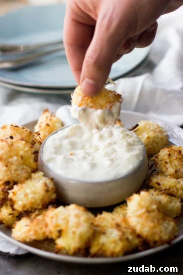 Baked Coconut Shrimp with the Best Tropical Dipping Sauce Baked Coconut Shrimp arranged with a bowl of Tropical Dipping Sauce