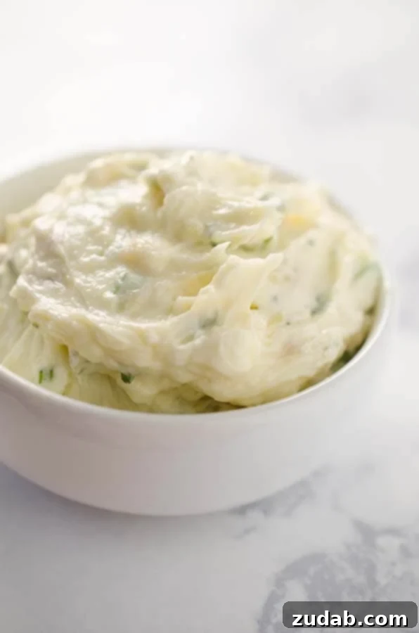 Roasted Garlic & Rosemary Whipped Butter Close-up of freshly made Roasted Garlic & Rosemary Whipped Butter in a bowl.