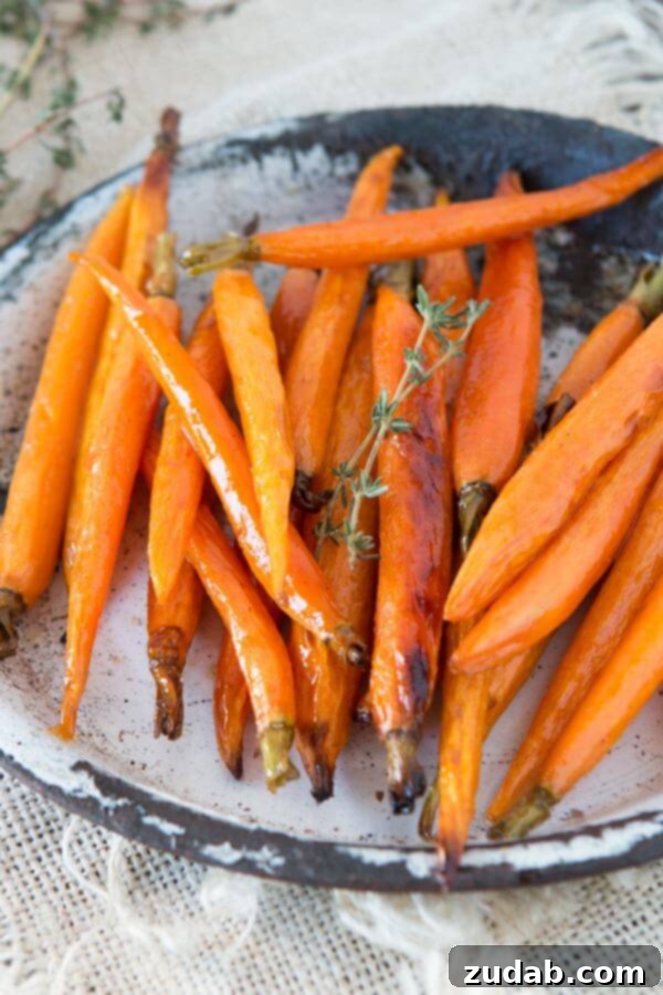 Our family's favorite side, honey roasted carrots. ohsweetbasil.com Discover the secret to perfectly sweet and savory honey roasted carrots, a truly irresistible side dish. ohsweetbasil.com