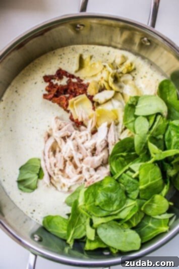Pesto Chicken Pasta with Sun-Dried Tomatoes and Artichokes Pesto Chicken Pasta: A Family Favorite with Mediterranean Flavors