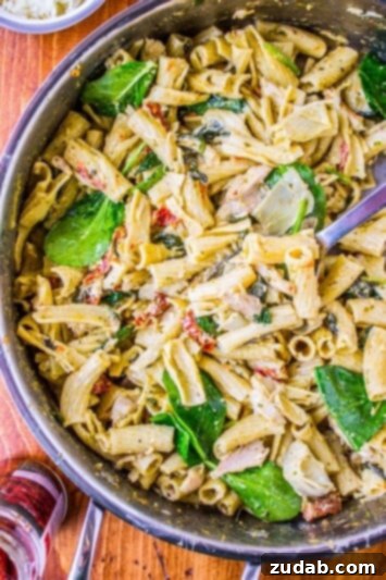Pesto Chicken Pasta with Sun-Dried Tomatoes and Artichokes Hearty Pesto Chicken Pasta with Sun-Dried Tomatoes and Artichokes