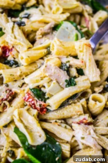 Pesto Chicken Pasta with Sun-Dried Tomatoes and Artichokes Quick and Easy Pesto Chicken Pasta Recipe for Busy Evenings