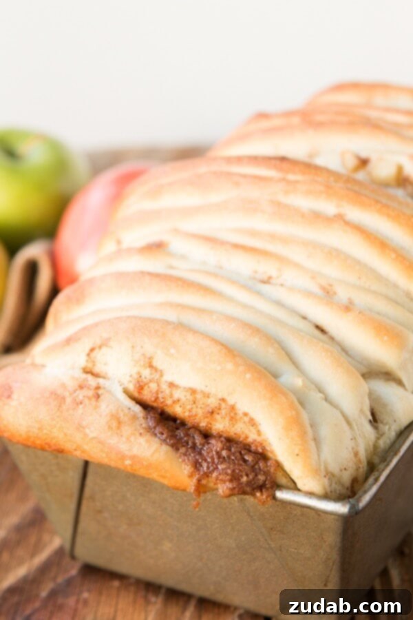 This is our new breakfast tradition, apple pie pull apart bread with maple glaze and it only takes frozen roll dough to get started! This is our new breakfast tradition, apple pie pull apart bread with maple glaze and it only takes frozen roll dough to get started!
