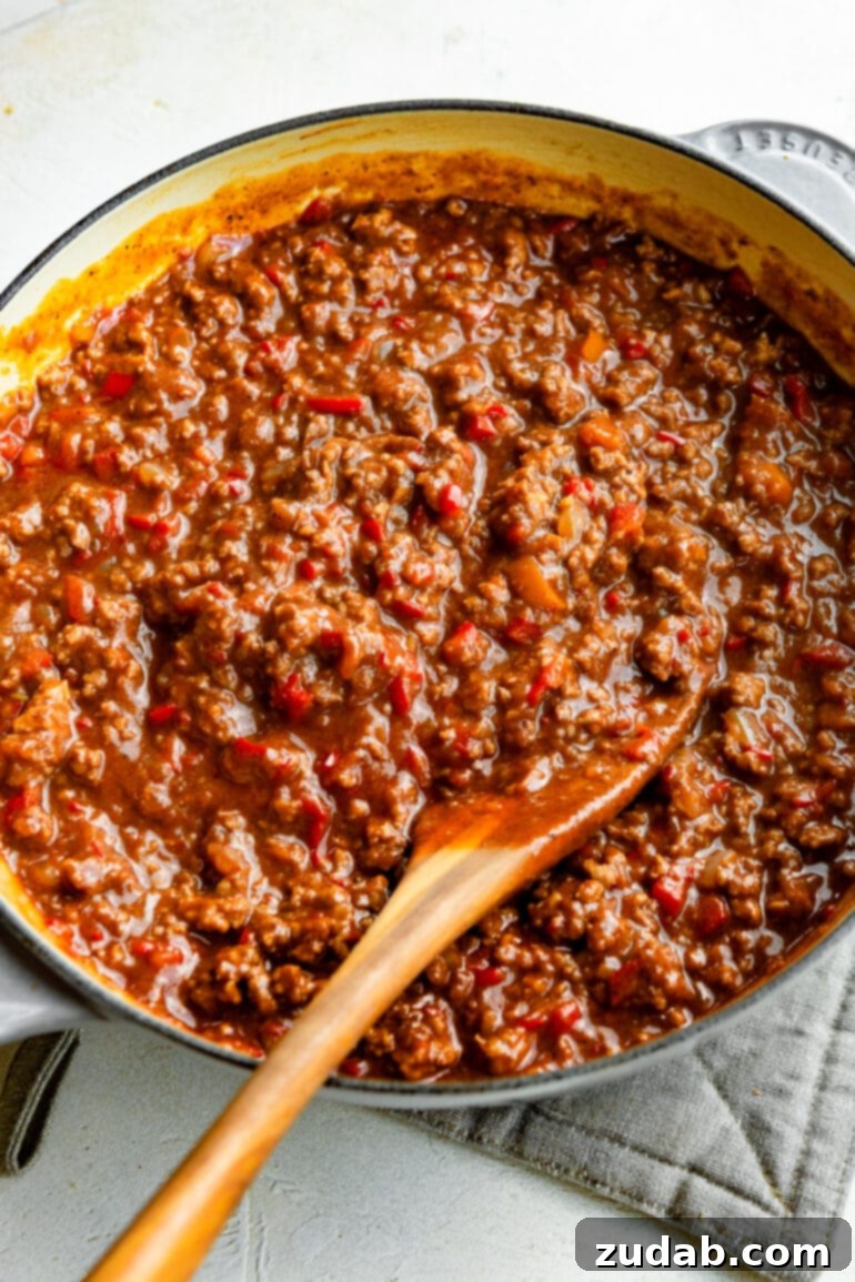 The Ultimate Sloppy Joe Recipe 5 A Dutch oven brimming with the delicious, saucy sloppy joe filling, with a wooden spoon resting inside, ready to be served.