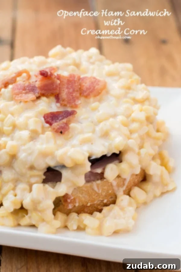 An open-faced ham sandwich with corn chowder, a hearty and delicious comfort food creation.