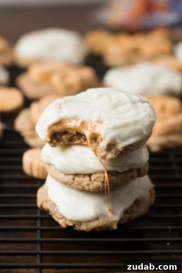 Sweater Weather Pumpkin Cookies 4 Gooey Pumpkin Spice Marshmallow Cookies with a smooth cream cheese frosting, an irresistible holiday treat.