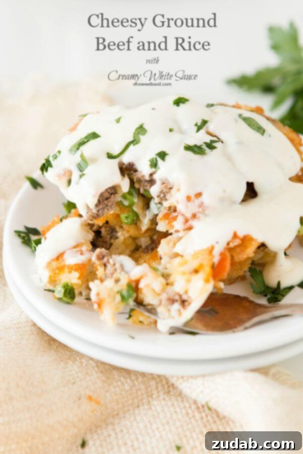 Reimagined family favorite: crispy cheesy ground beef and rice cakes with a luscious white sauce, ideal for an effortless weeknight dinner. ohsweetbasil.com