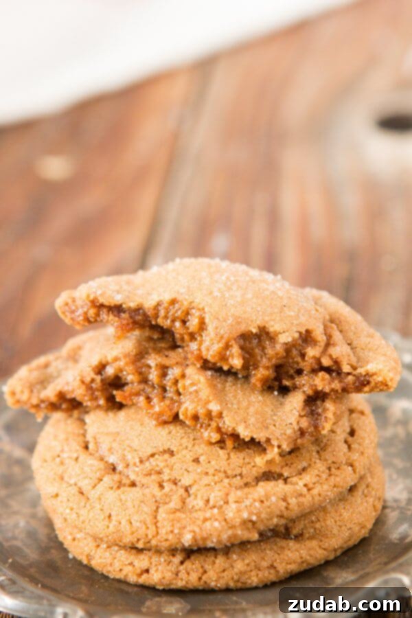 Soft and Fluffy Molasses Cookies Recipe Freshly baked soft and chewy molasses cookies cooling on a wire rack, perfect for comforting winter days.