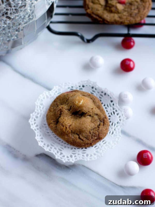 White Chocolate Peppermint Gingersnaps Festive white chocolate peppermint M&M gingersnap cookies, a joyful treat for the holidays.