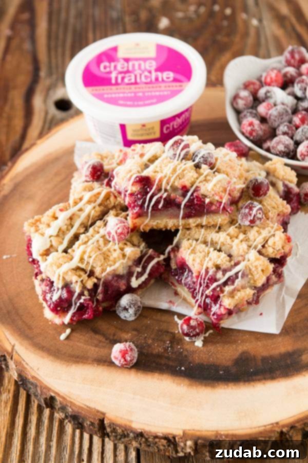 The perfect sweet and tart balance: White Chocolate Blackberry Cranberry Cream Bars Close-up of freshly baked White Chocolate Blackberry Cranberry Cream Bars