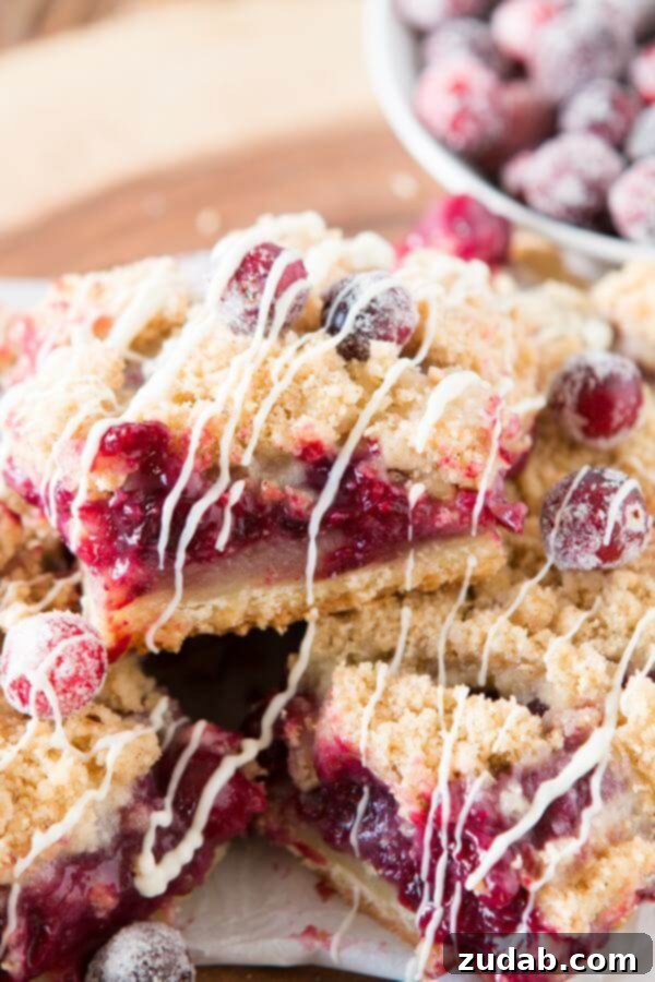 Homemade White Chocolate Blackberry Cranberry Cream Bars for any occasion Stack of White Chocolate Blackberry Cranberry Cream Bars on a serving platter