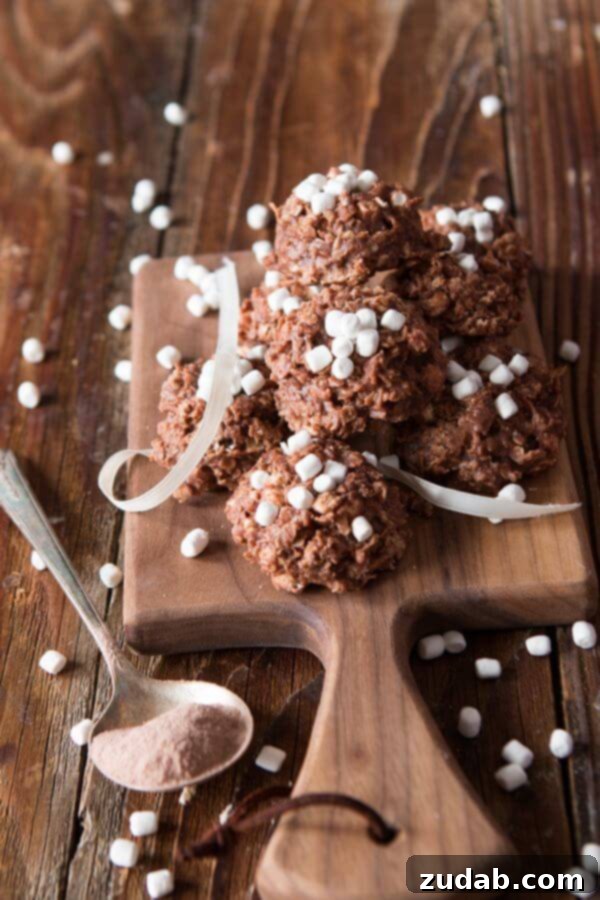 Perfectly Set Hot Cocoa No Bake Cookies Stack of hot cocoa no bake cookies, perfectly set with melted marshmallows