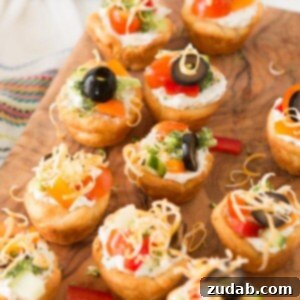 Party-Perfect Veggie Pizza Tarts 2 Quick and easy veggie pizza tarts with the best filling I've had for this easy appetizer ohsweetbasil.com