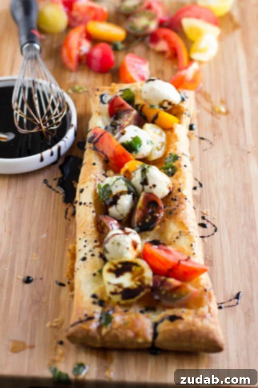 Party-Perfect Veggie Pizza Tarts 5 Heriloom-tomatoes-puff-pastry-marinated-mozzarella-and-balsamic-reduction-and-guess-what-all-of-it-is-premade-and-you-can-whip-it-all-together.-ohsweetbasil.com_-4-533x800
