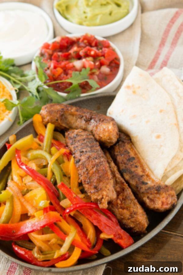 Sizzling Johnsonville Italian sausage strips mixed with colorful bell peppers and onions for fajitas.
