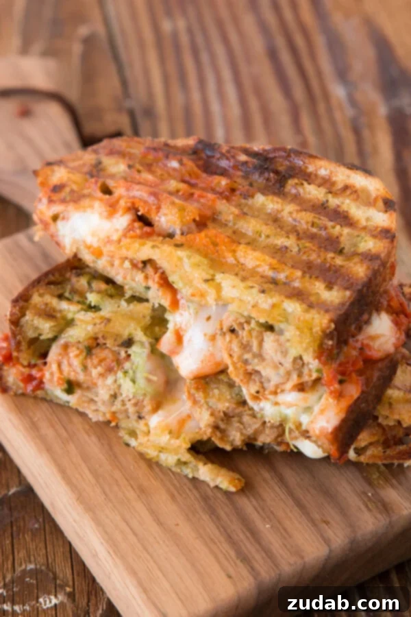 The ultimate Pesto Meatball Panini, a flavorful fusion recipe that combines the best of meatball subs and pesto chicken paninis for a unique meal.
