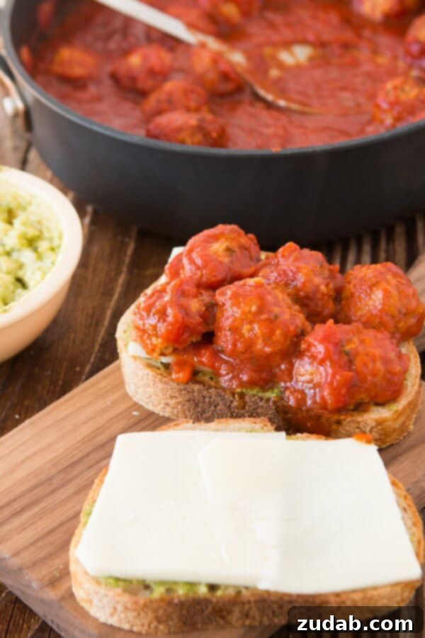 Enjoying a delicious Pesto Meatball Panini, a perfect quick dinner idea with Johnsonville Italian sausage meatballs.
