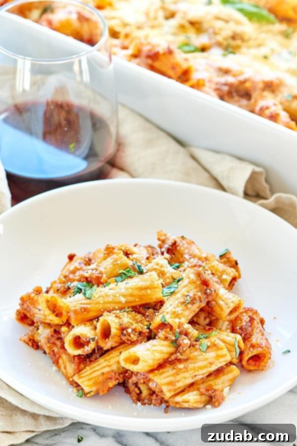 Spicy Sausage Rigatoni: A Comforting Fall Dinner with Homemade Marinara Spicy Sausage Rigatoni, a simple, hearty, and cozy fall dinner featuring rigatoni pasta, a rich homemade spicy sausage marinara sauce, and melted mozzarella cheese, perfect for family meals.