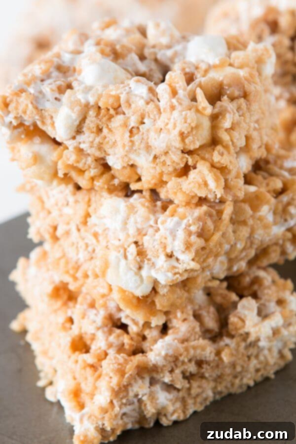 Gooey Fluffernutter Rice Krispies: The Ultimate No-Bake Peanut Butter Marshmallow Treat A delectable close-up of gooey Fluffernutter Rice Krispies, a no-bake marshmallow and peanut butter delight.