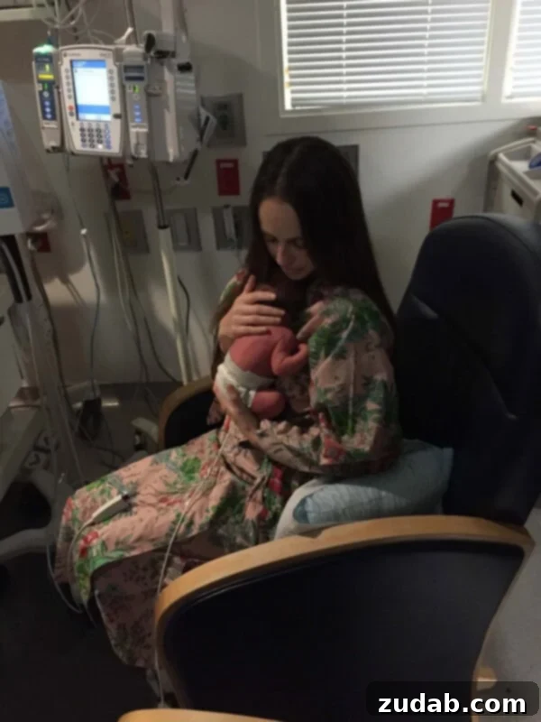 A tiny newborn's hand gripping an adult's finger, signifying early arrival and vulnerability