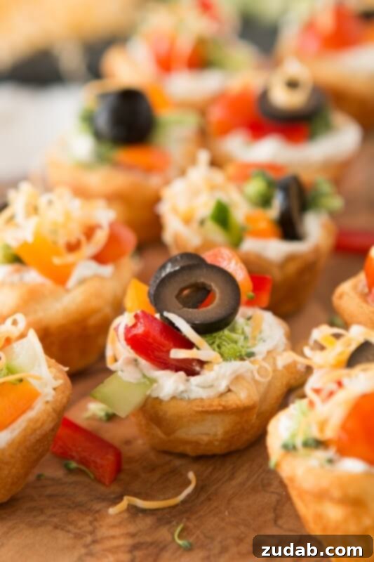 Festive Veggie Wreaths with Delightful Dips 5 I've had so many of these there wont be any left! Quick and Easy veggie pizza tarts appetizer ohsweetbasil.com