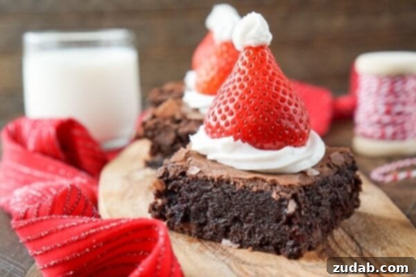 Cute Christmas Brownie Treats for Family Fun A festive spread of Santa Hat Brownies, showcasing their charming design, perfect for holiday gatherings.