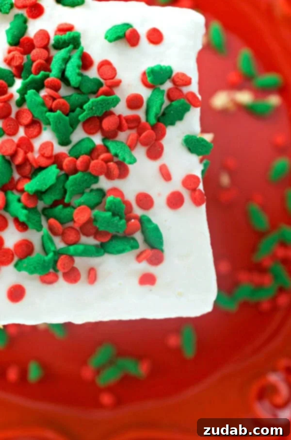 Festive and Easy Eggnog Poke Cake Eggnog Poke Cake with a creamy topping, ready to serve