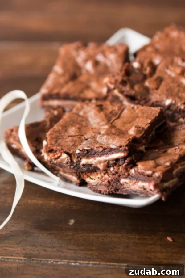 Gooey Ghirardelli Peppermint Bark Brownies A tray of freshly baked, gooey Peppermint Bark Brownies, ready to be sliced