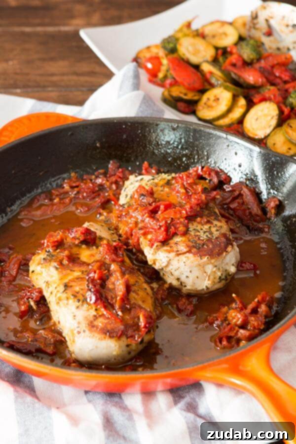 Simple marinated citrus Greek chicken with a two ingredient sauce. It's perfect all year round! An overhead shot showcasing the complete Citrus Greek Chicken meal, beautifully plated with sides, ready to be enjoyed.