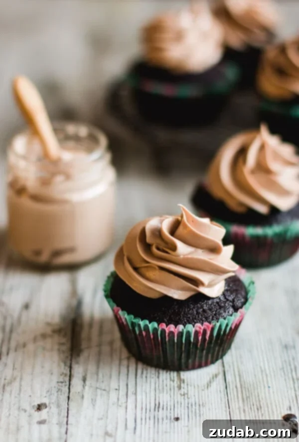 Moist Milk Chocolate Cupcakes with Smooth Frosting Decadent milk chocolate cupcakes with creamy milk chocolate frosting, a truly irresistible treat.