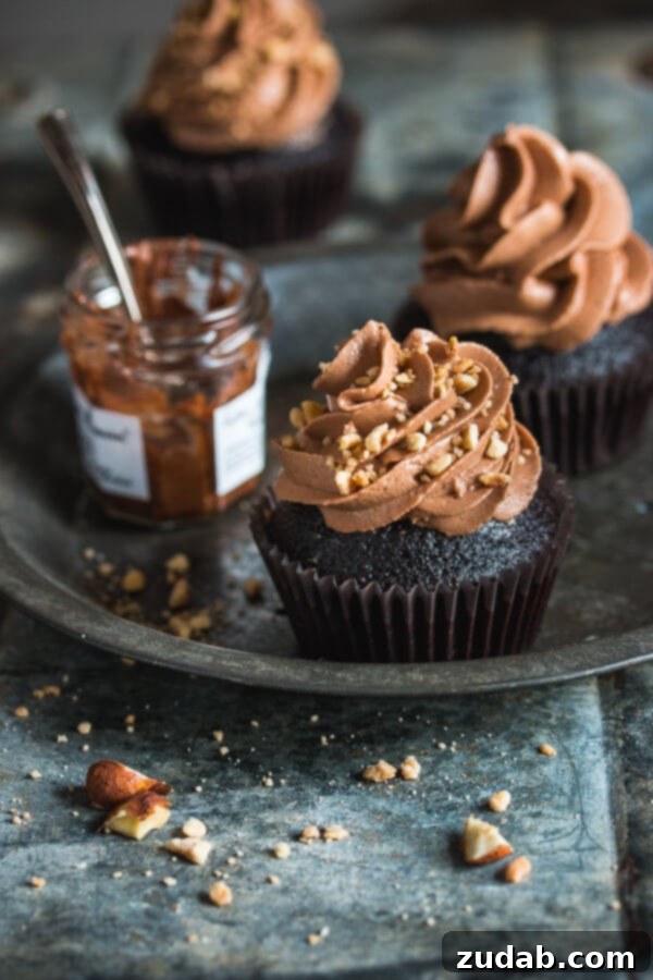 Decadent Milk Chocolate Dreams 5 Delicious Nutella cupcakes topped with a swirl of hazelnut chocolate frosting.