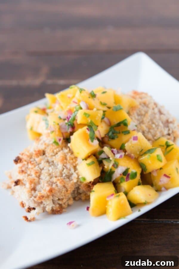 Perfectly cooked macadamia crusted mahi mahi with a hint of tropical flair Close-up of golden macadamia crusted mahi mahi