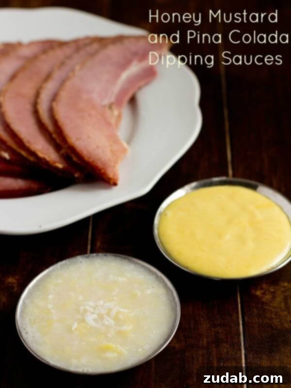 The World's Best Brown Sugar Ham, made with ease in the oven or slow cooker, complemented by delicious dipping sauces. Two festive ham dipping sauces, Honey Mustard and Pina Colada, presented alongside a plate of beautifully glazed ham slices.