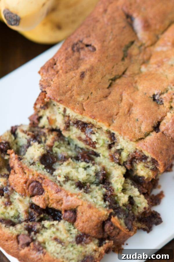 Heirloom Basil Delights 11 Decadent Chocolate Chip Banana Zucchini Bread, a moist and flavorful loaf that combines sweet and healthy ingredients.